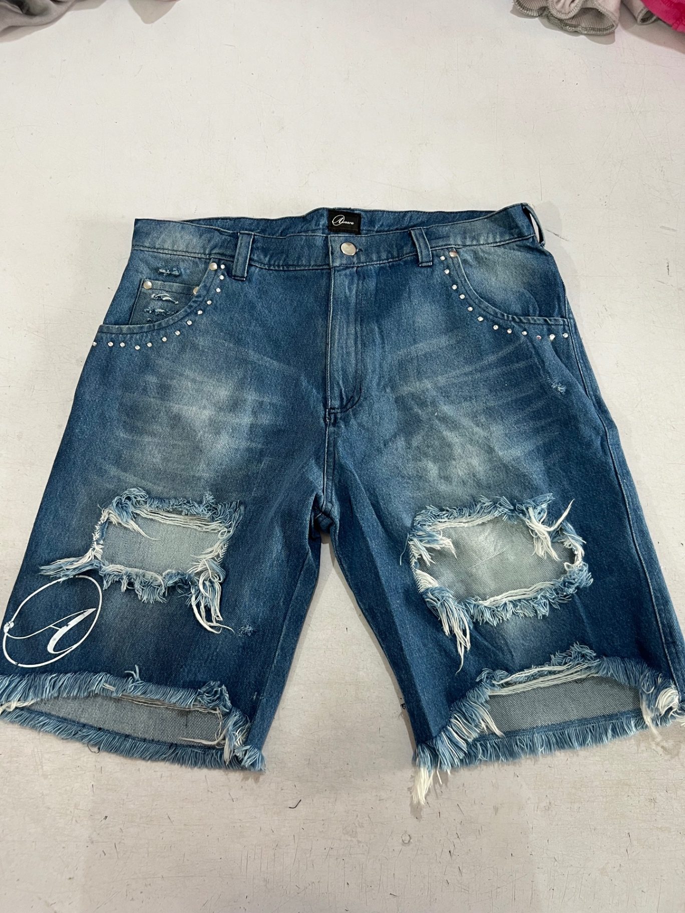 Distressed washed denim shorts sample