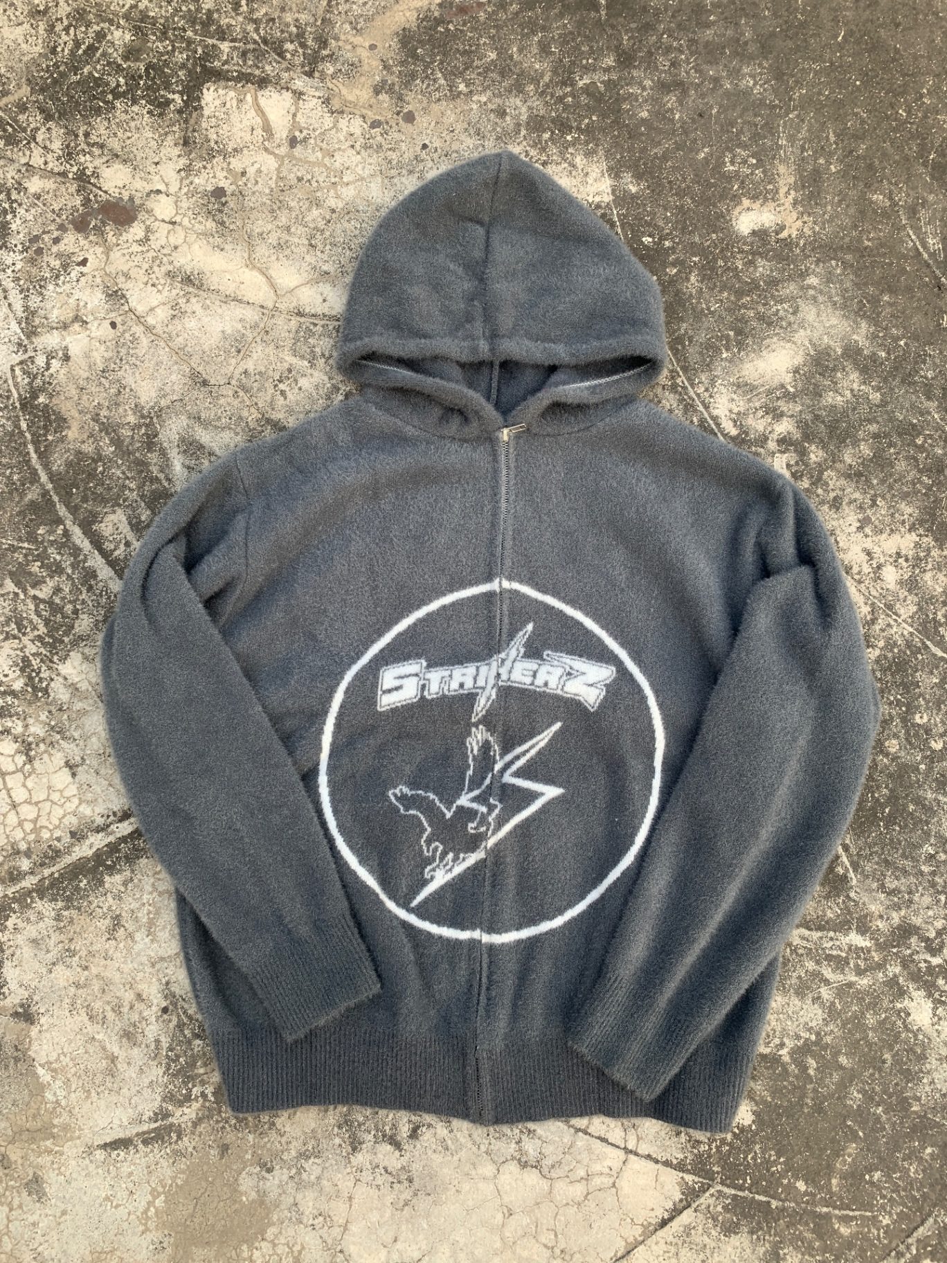 Fuzzy brushed grey full-zip hoodie with embroidered patch